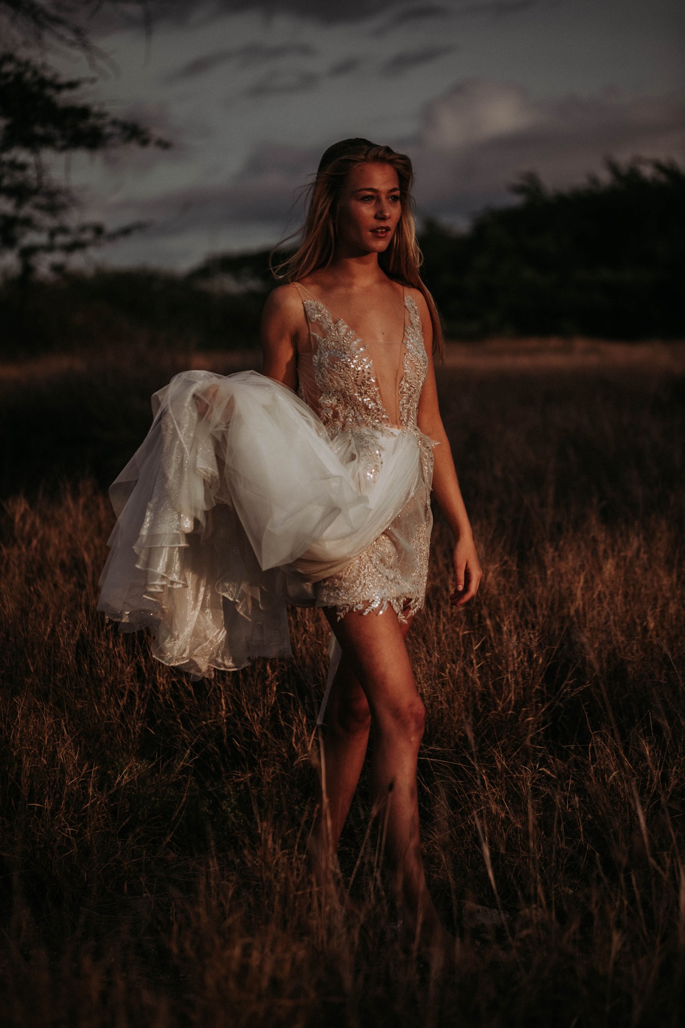 blond model lifting the dress, sophistication